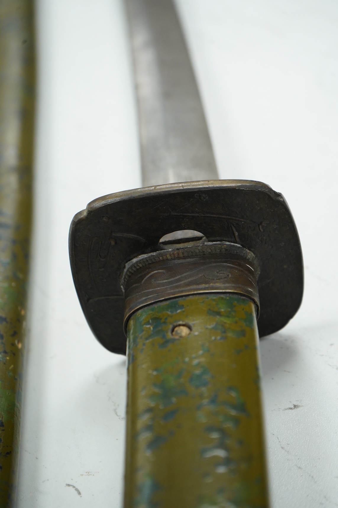 A well-made Chinese copy of a Japanese sword katana, blade etched with wood grain imitation, green painted handle, scabbard with engraved brass mounts